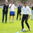 Prime Minister Rishi Sunak during his visit to Chesham United Football Club, while on the General Election campaign trail.