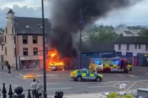 Video circulated by the Facebook page NI Against Illegal Immigration (39,000 followers) showing the Kilkeel incident, with the caption: 'A car on fire goes through an African shop'