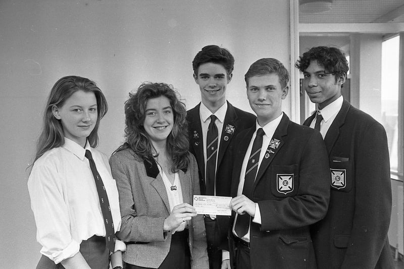 Pupils at Methodist College Belfast had been keeping themselves, apart from their studies in March 1992, reported the News Letter. Proceeds of coffee bar sales and discos run by the college 6rh form committee were handed over to Action Cancer, pictured are Mark Anderson, Karen Sloan, Ian Taylore, Ziad Mutasim presenting a £1,500 cheque to Janet Stevenson of Action Cancer. Picture: News Letter archives