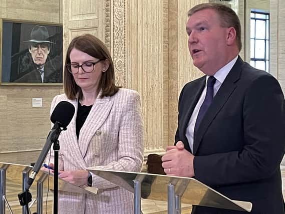 Stormont Finance Minister Caoimhe Archibald (left) with Irish Minister of Finance Michael McGrath speaking to media in the Great Hall at Parliament Buildings, Stormont, following an Irish government funding announcement for a number of projects, including the proposed upgrade of the A5 and rebuilding of Casement Park