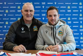Linfield captain Jamie Mulgrew pictured with chief scout Willie McKeown after signing a contract extension. PIC: PACEMAKER BELFAST