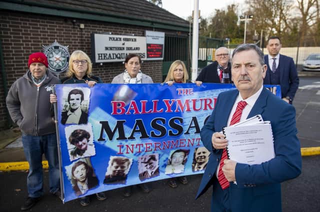 John Teggart (front) with other members of the Ballymurphy families and their solicitor Padraig O Muirigh (back right) stand together outside PSNI Headquarters at Knock before a meeting with Assistant Chief Constable Alan Todd.