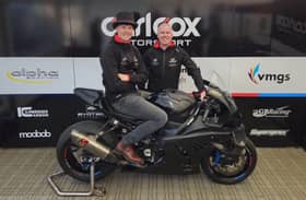 Storm Stacey with Michael Laverty and the Alpha Racing by GRYD BMW Superstock machine he will ride on his debut at the North West 200.