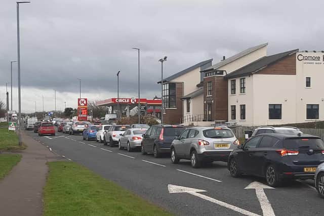 Northern Ireland motorists rush to the pumps as Circle K slash fuel price for one day only. This was the scene at Portstewart. Similar scenes repeated across the province