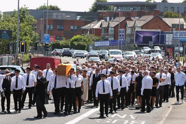 The coffin of Joe Clarke, one of a group known as the Hooded Men, is carried for burial at Milltown Cemetery in west Belfast. The News Letter reported that it was an IRA funeral while two rival daily papers carried photographs of the funeral but did not use any words that explained that the images showed he was being given terrorist honours. Photo: Liam McBurney/PA Wire