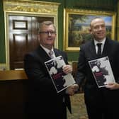 DUP leader Sir Jeffrey Donaldson and NI Secretary Chris Heaton-Harris with copies of the ‘Safeguarding the Union’ document. Photo: Niall Carson/PA Wire