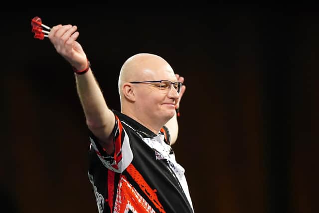 Mickey Mansell reacts after winning against Xiaochen Zong on day seven of the Paddy Power World Darts Championship at Alexandra Palace, London. PIC: Zac Goodwin/PA Wire.