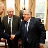 Omagh bomb campaigners Stanley McCombe (right) and Michael Gallagher (centre) meeting with Tanaiste Micheal Martin at Iveagh House, Dublin