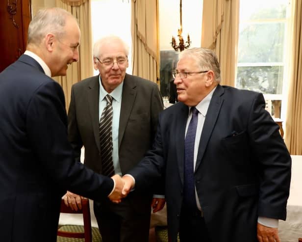 Omagh bomb campaigners Stanley McCombe (right) and Michael Gallagher (centre) meeting with Tanaiste Micheal Martin at Iveagh House, Dublin