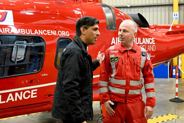 Prime Minister Rishi Sunak (left) during a visit to Air Ambulance Northern Ireland at their headquarters in Lisburn on Sunday night. Downing Street respects the Policy Exchange think tank which is calling for London to reclaim its strategic interest in Northern Ireland. Photo: Carrie Davenport/PA Wire