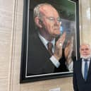 MP Francie Molloy, beside a portrait of Martin McGuinness in the Great Hall of Parliament Buildings, Stormont, as he announced he would not be seeking re-election in the Mid Ulster constituency in the next UK general election