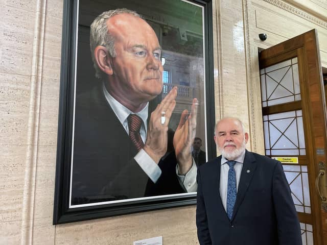 MP Francie Molloy, beside a portrait of Martin McGuinness in the Great Hall of Parliament Buildings, Stormont, as he announced he would not be seeking re-election in the Mid Ulster constituency in the next UK general election