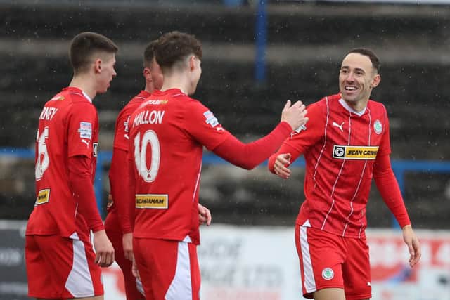 Cliftonville players celebrate Sam Ashford's winner against Coleraine at The Showgrounds