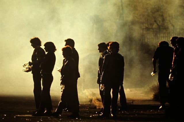 Youths with petrol bombs during Rioting on the Falls Road, West Belfast, Northern Ireland, The Troubles, 1976 by Alain Le Garsmeur