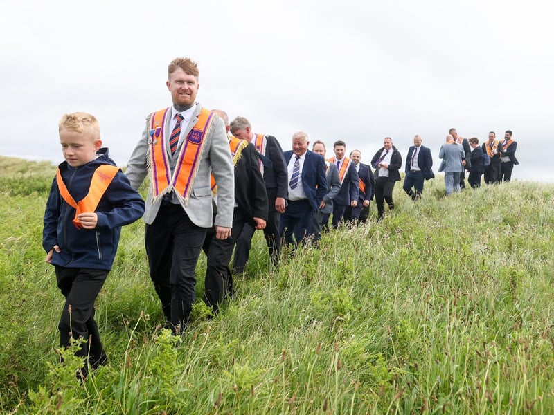 Orangemen make their way to the beach