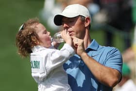 Rory McIlroy with his daughter Poppy during yesterday's Par 3 contest prior to the 2023 Masters starting today at Augusta National