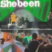 Footage of the crowd joining in a chorus of the IRA chant 'Tiocfaidh ár lá' and 'Ooh ah up the Ra' at a support act to the Wolf Tones concert at Falls Park on Sunday August 13 the the west Belfast Féile an Phobail