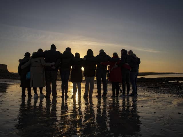 Victims and survivors of the Troubles gather in  Killough, Downpatrick, Co Down, to watch the sun rise to mark the 25th anniversary of the Good Friday Agreement. Picture date: Friday April 7, 2023. PA Photo. See PA story ULSTER Agreement. Photo credit should read: Liam McBurney/PA Wire