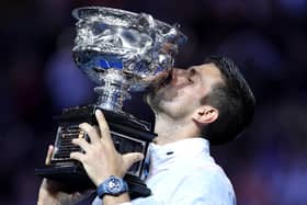 Novak Djokovic poses with the Norman Brookes Challenge Cup after beating Stefanos Tsitsipas to win the Australian Open at Melbourne Park on Suday. (Photo by Clive Brunskill/Getty Images)