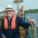 Rick Stein in lifejacket on fishing boat