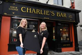 Una Burns, manager and third generation of family owned Charlie’s Bar Enniskillen is joined by Sarah Thompson, founder of embroidery company, Ted and Stitch, at the announcement that the two local businesses have teamed up to launch of a limited edition apparel range after the bar’s Christmas advert went viral around the world and captured the hearts of millions of people