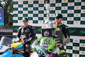 Donegal's Caomhan Canny celebrates his victory in the Senior Manx Grand Prix as dejected runner-up Chris Cook looks on. (Photo by Stephen Davison/Pacemaker Press)