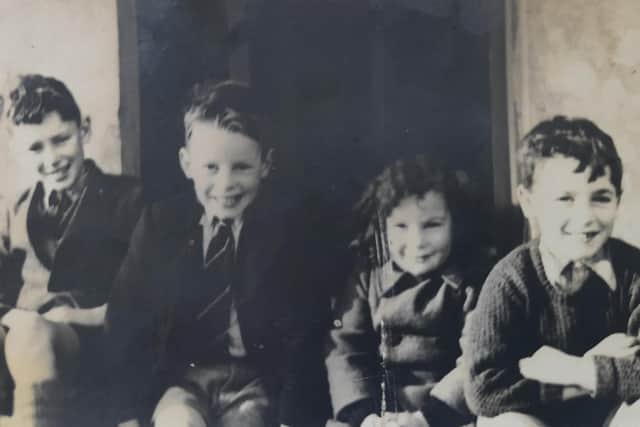Colin (extreme right), with his two elder brothers and younger sister, at roughly the age he was when he saw the HMS Belfast launched in 1938