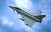 Two RAF Typhoon jet fighters shook homes over greater Belfast area while intercepting a suspicious aircraft.
