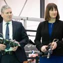 Labour leader Sir Keir Starmer and Shadow chancellor Rachel Reeves hold drills used for aeroplane wing assembly, during a walkabout at UCL in the Queen Elizabeth Olympic Park, London. Picture date: Thursday January 5, 2023.