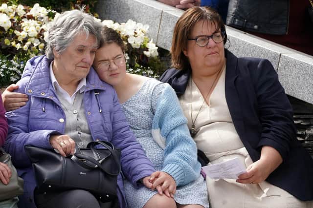Edith White (left) who lost her husband Fred and son Bryan in the bombing, with grand daughter Bethany (centre) and daughter Linda (right) during a service to mark the 25th anniversary of the Omagh bomb