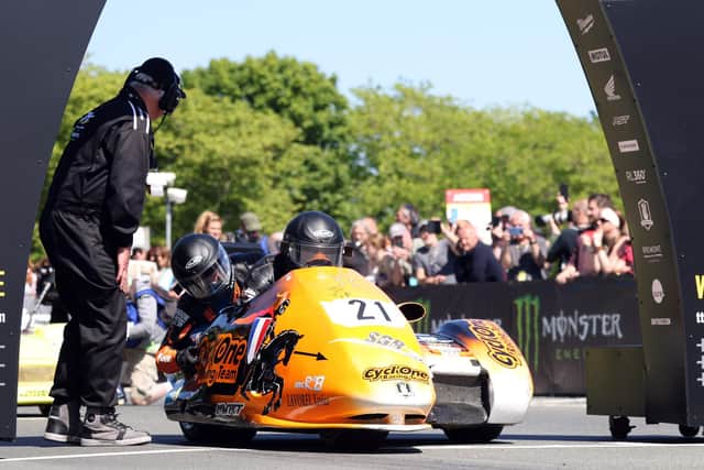 French Sidecar crew César Chanal and Olivier Lavorel leave the startline in the ill-fated opening Sidecar race at the Isle of Man TT in 2022.