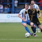 Andrew Ryan of Larne and Coleraine midfielder Stephen Lowry pictured in action during the Danske Bank Premiership clash at The Showgrounds.
  



Photo Desmond  Loughery/Pacemaker Press