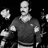Following a shoot-out with Gardai, RUC members take custody of Dominic McGlinchey who was handed over to the RUC by members of the Gardai at the border near  Carrickdale outside Dundalk, circa March 1984
