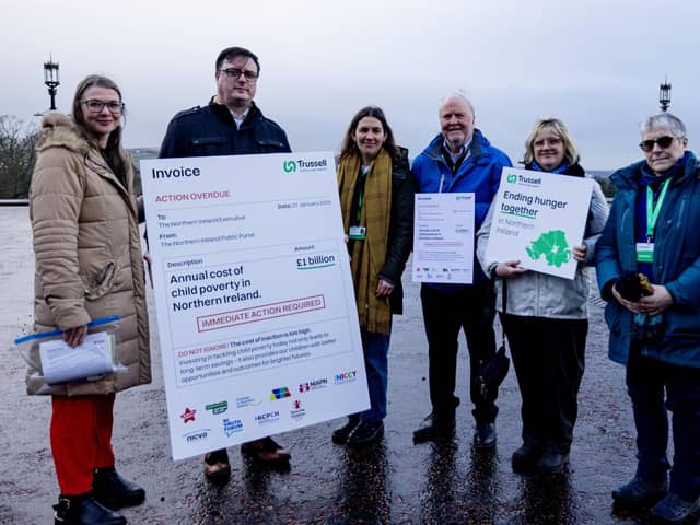Charity staff and food bank volunteers present Stormont with an invoice for the cost of inaction on child poverty
