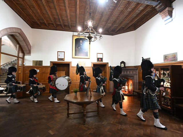 The Campbell College Pipe Band lead the guests into the Central Hall for their meal at the OC Ball organised by the Old Campbellian Society.