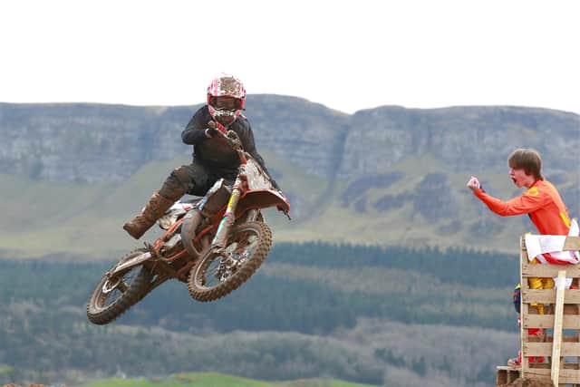 B/W 85 overall winner Bobby Burns is cheered on by pit bike winner Robbie McCullough at Magilligan.