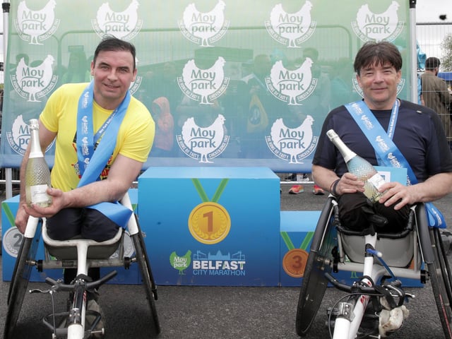 (Right) Paul Hannon winner and second place Carol Doherty in the wheelchair race of the 2024 Moy Park Belfast City Marathon.