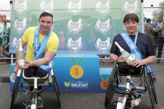 (Right) Paul Hannon winner and second place Carol Doherty in the wheelchair race of the 2024 Moy Park Belfast City Marathon.