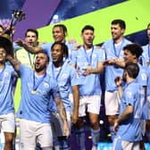 Manchester City's Kyle Walker lifts the FIFA Club World Cup trophy after victory over Fluminense at King Abdullah Sports City in Jeddah, Saudi Arabia. (Photo by Francois Nel/Getty Images)