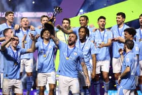 Manchester City's Kyle Walker lifts the FIFA Club World Cup trophy after victory over Fluminense at King Abdullah Sports City in Jeddah, Saudi Arabia. (Photo by Francois Nel/Getty Images)