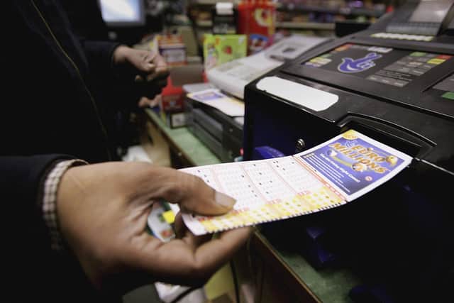 A newsagent sells a Euromillion ticket. (Photo by Bruno Vincent/Getty Images)