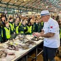Master Fishmonger Hal Dawson showing the Kids’ Club fish varieties at St George’s Market in Belfast;