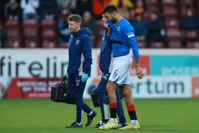 Rangers' Connor Goldson goes off injured during the cinch Premiership match at Fir Park, Motherwell. PIC: Steve Welsh/PA Wire.