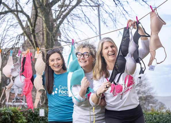 Joanne Jones, from Ballyclare, one of the women who has benefitted from the support of Cancer Focus NI, is pictured with the charity’s bra-fitting expert Emma Wilson, and group co-ordinator, Caroline Hart.