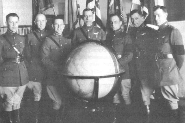 Leading pilots, from left, John Harding, Erik Nelson, Leigh Wade, Frederick Martin, Leslie Arnold, Lowell Smith and L.D. Schulze. (Schulze and Arnold were subs)