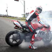 North West 200 Superbike race winner Glenn Irwin celebrates with a burnout on his BeerMonster Ducati on Saturday
