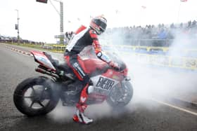 North West 200 Superbike race winner Glenn Irwin celebrates with a burnout on his BeerMonster Ducati on Saturday
