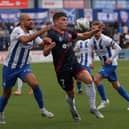 Darren Cole pays close attention to Hamilton's Euan Henderson during the clash at The Showgrounds
