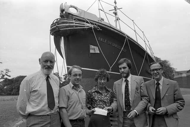 Andy Anderson, second from left, assistant education officer of the Ulster Folk and Transport Museum, presents a £640 cheque to Ray Kipling. PRO of the Royal National Lifeboat Institution in late July 1982. Mr Anderson had raised the cash by completing the London Marathon. With them are Mrs May McMaster, Northern Ireland’s assistant organiser of the RNLI, Colonel Brian Clark, left, national organiser (Ireland), and museum director George Thompson. The presentation took place at Cultra. Picture: News Letter archives