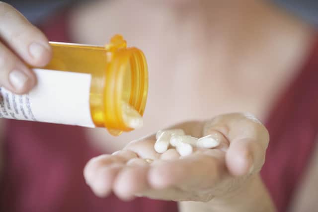 A generic photo of a woman taking her antibiotics. PA Photo/thinkstockphotos